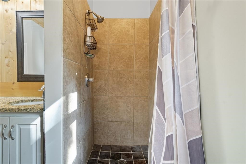 491 Hyde Road Jasper, GA 30143 - Photo 19 of 60 a bathroom with a granite countertop shower and a sink