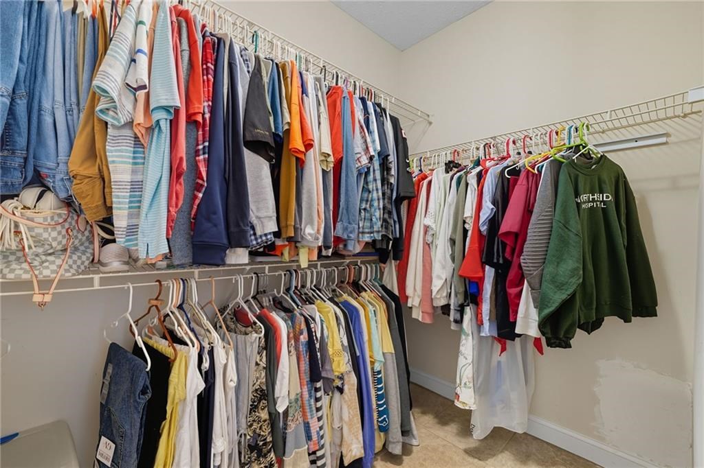 491 Hyde Road Jasper, GA 30143 - Photo 21 of 60 a view of walk in closet with clothes