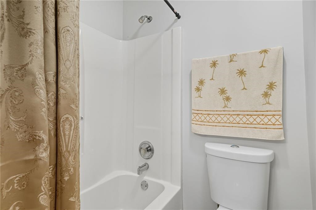 491 Hyde Road Jasper, GA 30143 - Photo 27 of 60 a bathroom with a shower and a toilet