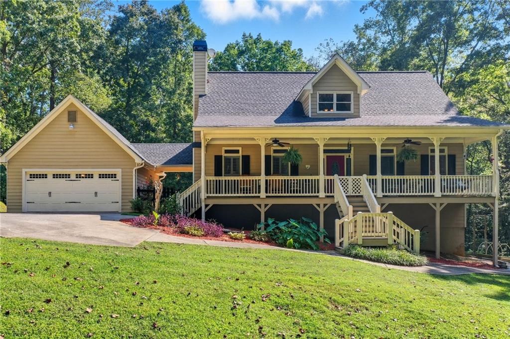 491 Hyde Road Jasper, GA 30143 - Photo 3 of 60 a front view of a house with a yard and potted plants