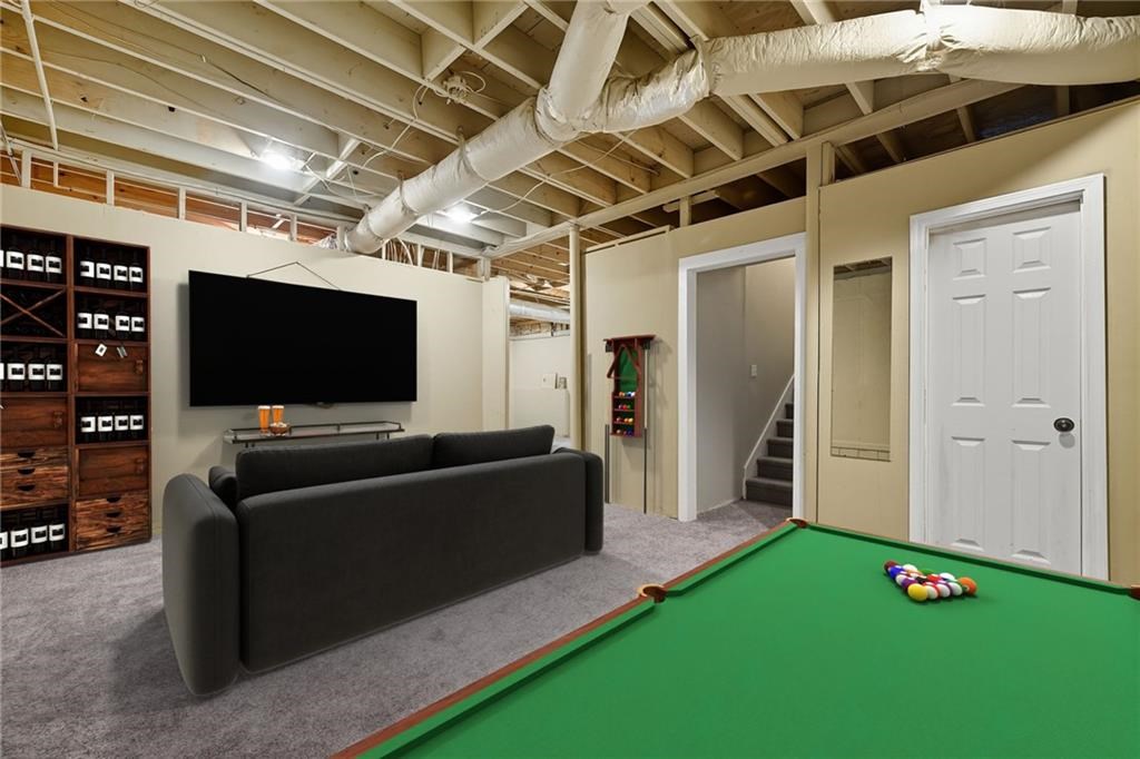 491 Hyde Road Jasper, GA 30143 - Photo 32 of 60 a living room with furniture and a flat screen tv