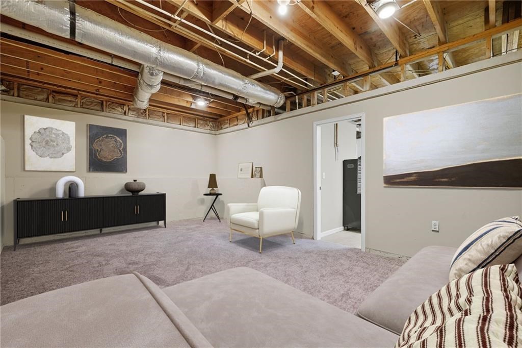 491 Hyde Road Jasper, GA 30143 - Photo 34 of 60 a living room with furniture a rug and white walls
