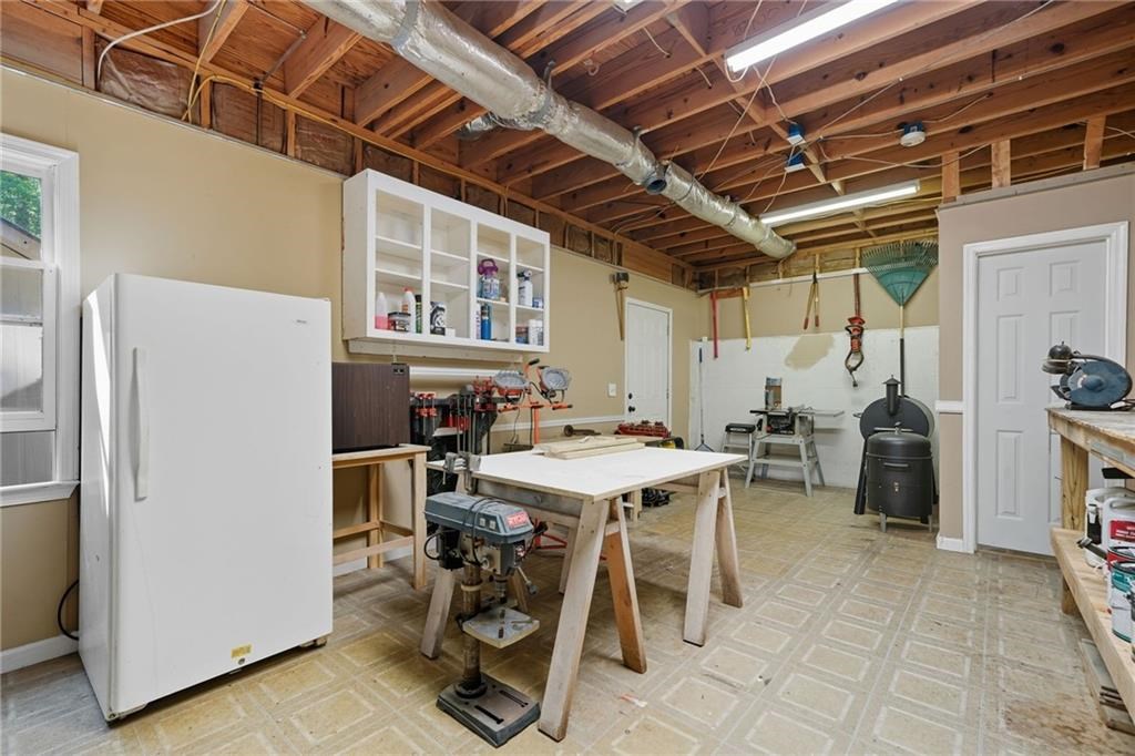 491 Hyde Road Jasper, GA 30143 - Photo 35 of 60 a view of a dining room with furniture and a kitchen