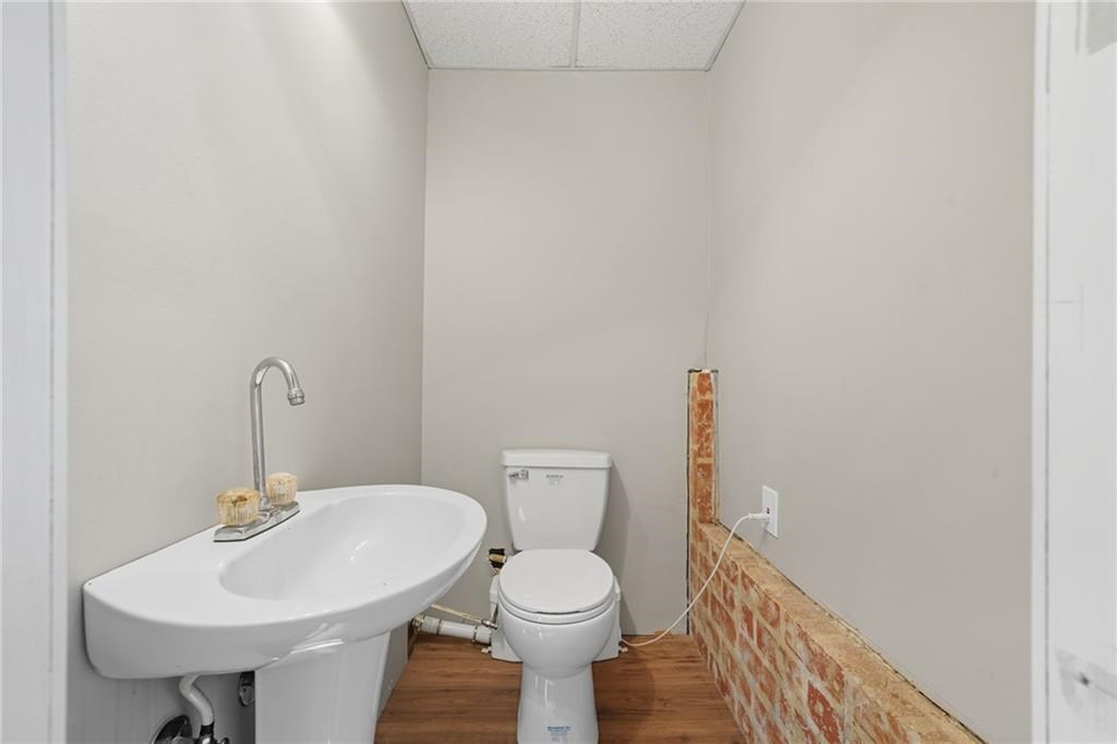 491 Hyde Road Jasper, GA 30143 - Photo 37 of 60 a bathroom with a sink a toilet and mirror