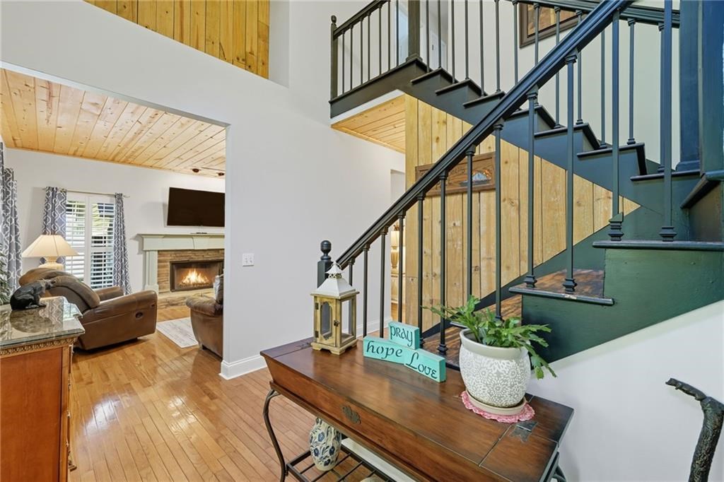 491 Hyde Road Jasper, GA 30143 - Photo 4 of 60 a dining room with furniture a potted plant and wooden floor