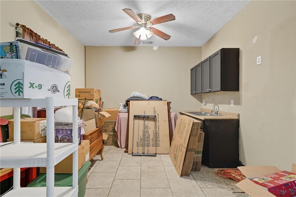 491 Hyde Road Jasper, GA 30143 - Photo 41 of 60 a view of a workspace with furniture and a flat screen tv