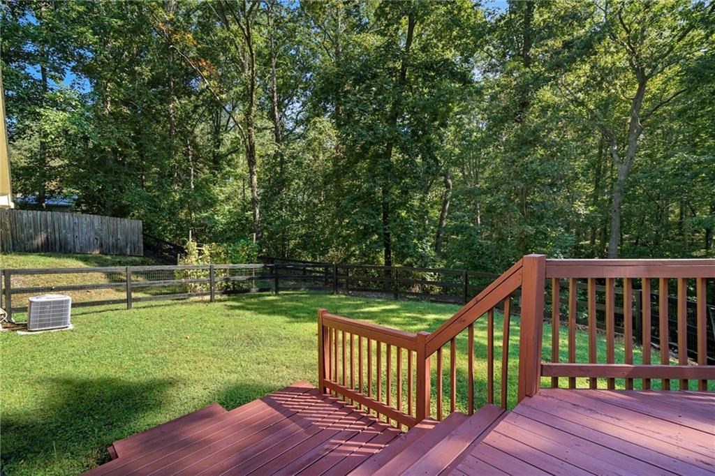 491 Hyde Road Jasper, GA 30143 - Photo 43 of 60 a view of a wooden deck and a yard with swimming pool