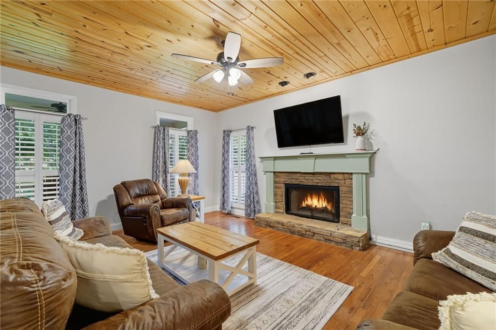 491 Hyde Road Jasper, GA 30143 - Photo 6 of 60 a living room with furniture a flat screen tv and a fireplace