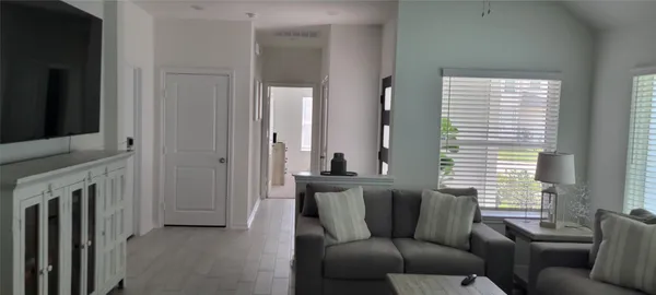 a view of a hallway with a furniture