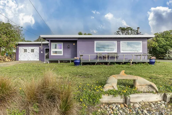a view of a house with a backyard