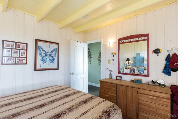 a bed room with a bed and a window