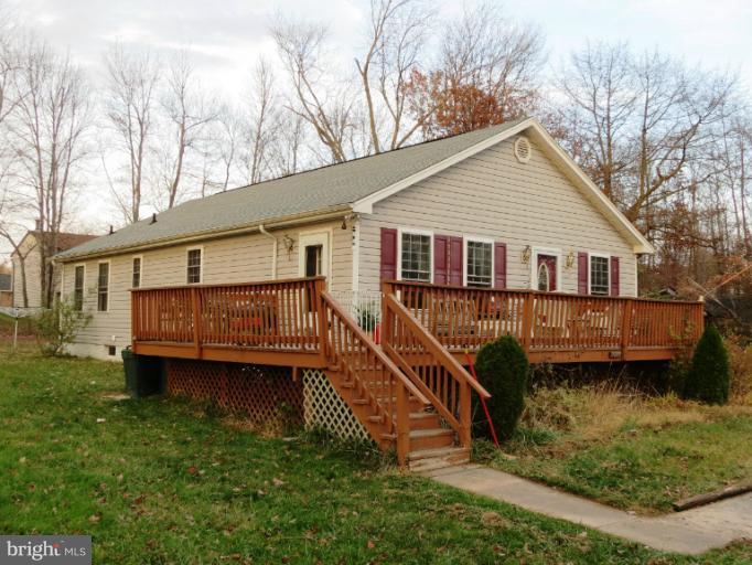 4814 Valley Forge Road Randallstown, MD 21133 - Photo 1 of 16 a view of a house with a yard and a wooden deck