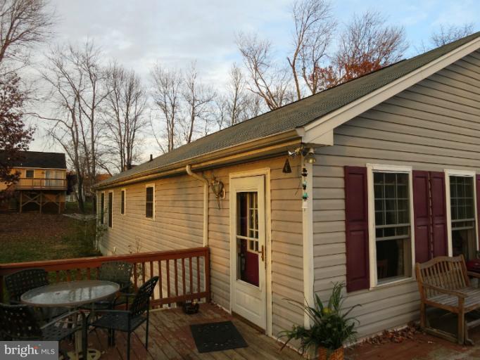 4814 Valley Forge Road Randallstown, MD 21133 - Photo 12 of 16 front view of a house with a table and chairs