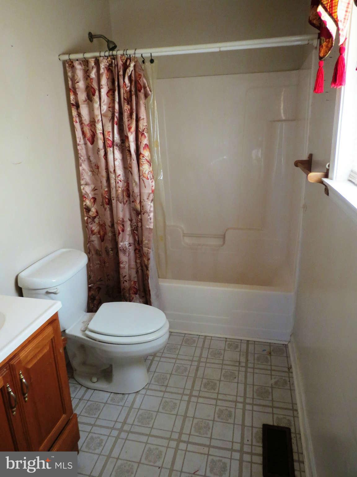 4814 Valley Forge Road Randallstown, MD 21133 - Photo 7 of 16 a bathroom with a toilet and shower