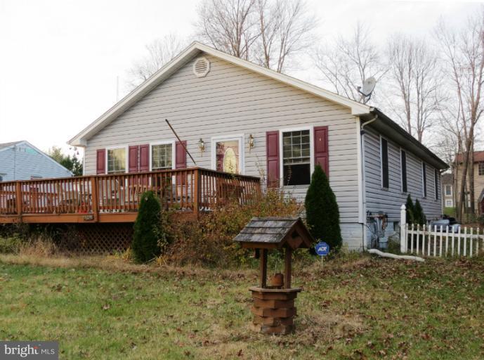 4814 Valley Forge Road Randallstown, MD 21133 - Photo 10 of 16 a view of a house with wooden deck area and furniture