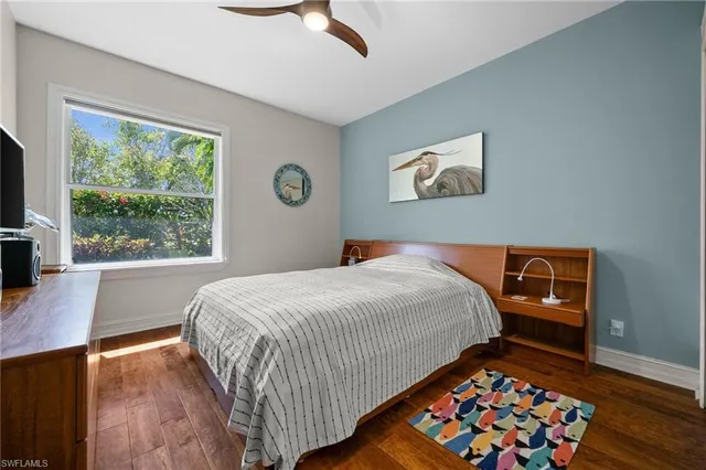 a bedroom with bed and window