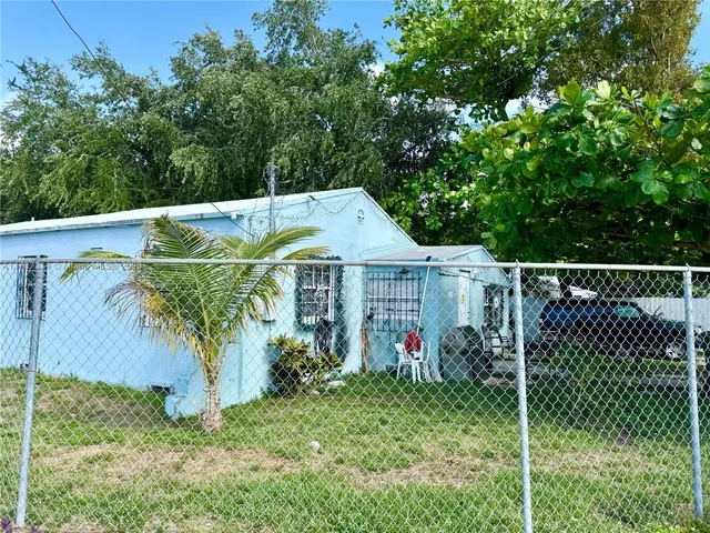 a view of a wrought iron fences in front of a yard