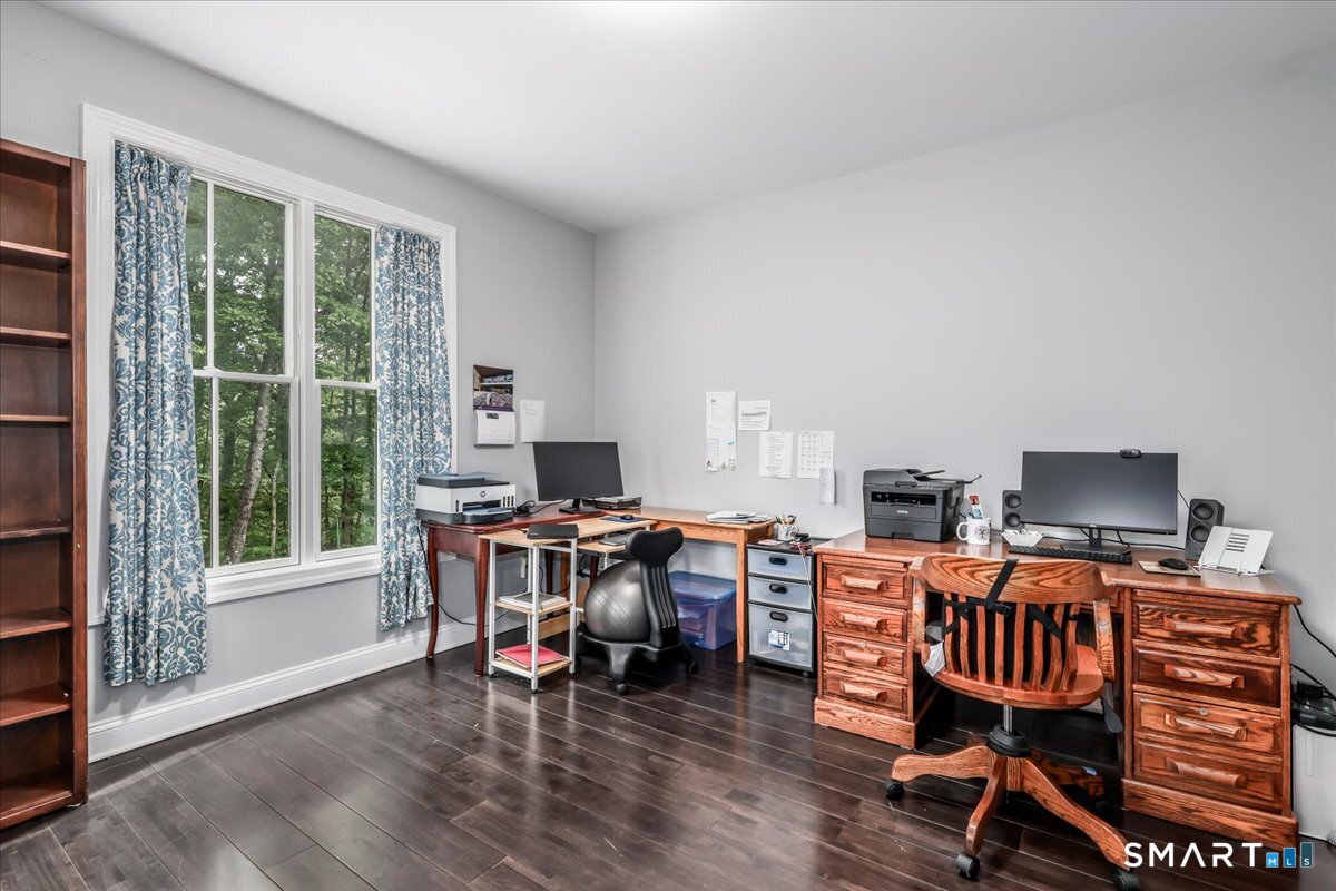 127 Putnam Park Road Bethel, CT 06801 - Photo 11 of 35 a view of a workspace with furniture and a window