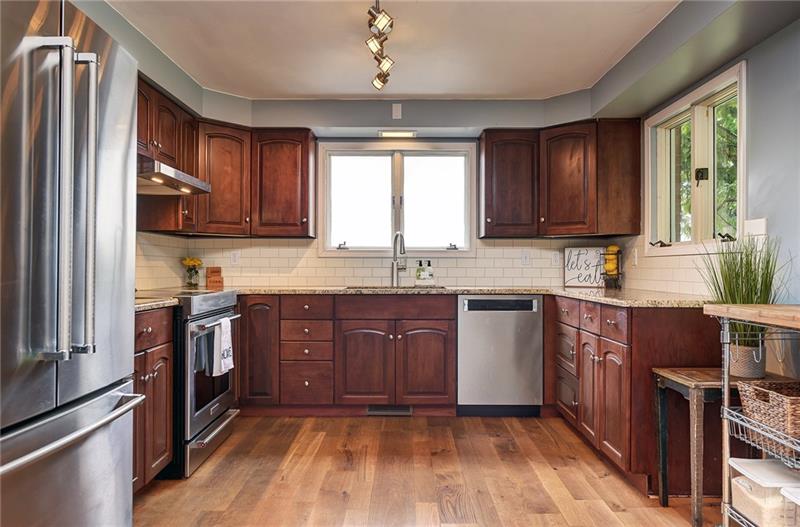 14 Conklin Road Washington, PA 15301 - Photo 6 of 25 Kitchen Renovation (2018) Granite countertops, tile backsplash, stainless steel appliances, new lighting kitchen sink and plumbing fixtures