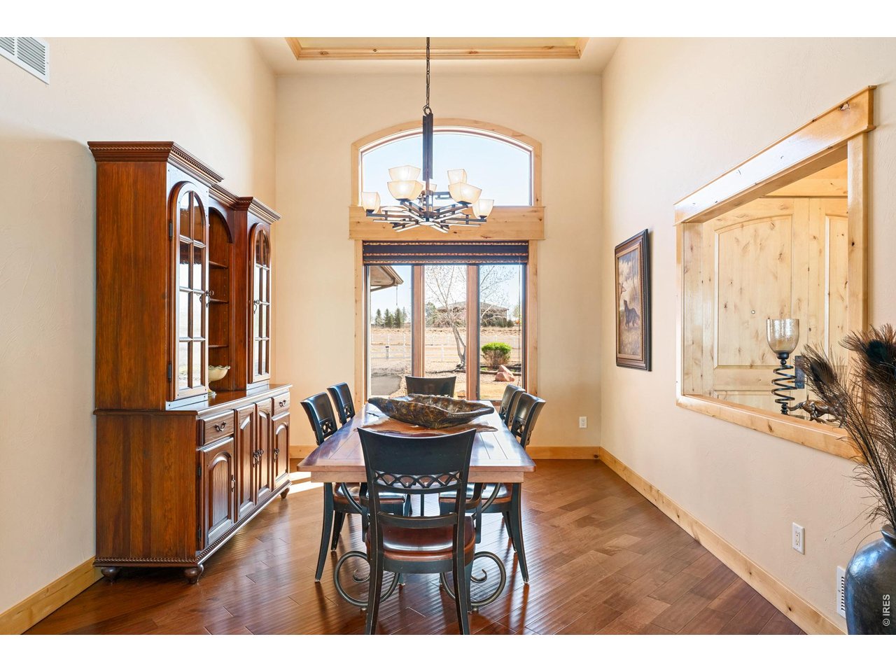 3032 Center Ridge Drive Berthoud, CO 80513 - Photo 11 of 44 Multi-level lighted ceilings add architectural dimension in this spacious dining room.