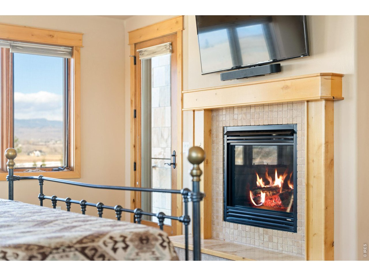 3032 Center Ridge Drive Berthoud, CO 80513 - Photo 17 of 44 Primary Bedroom with gas fireplace.