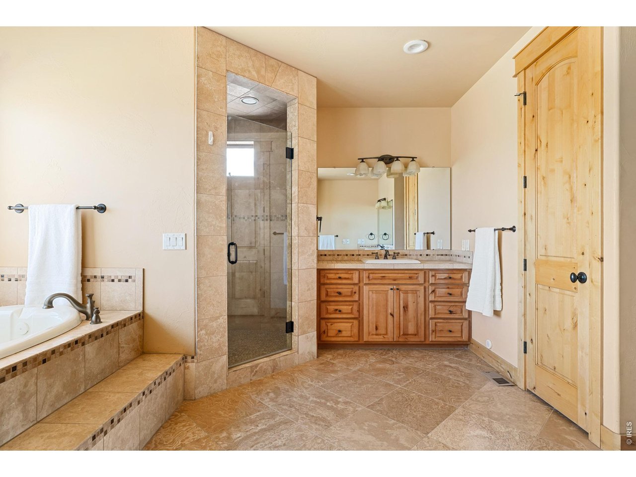 3032 Center Ridge Drive Berthoud, CO 80513 - Photo 20 of 44 The spacious primary bathroom includes two dedicated sink areas designed for ease and privacy