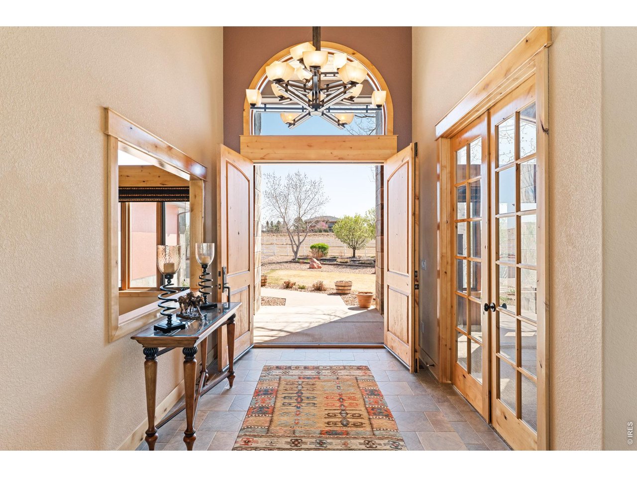 3032 Center Ridge Drive Berthoud, CO 80513 - Photo 2 of 44 An impressive foyer offers a warm and sophisticated welcome.