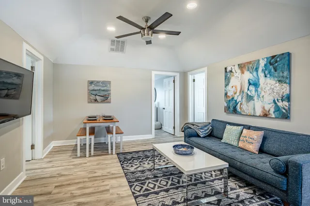 a living room with furniture and a rug