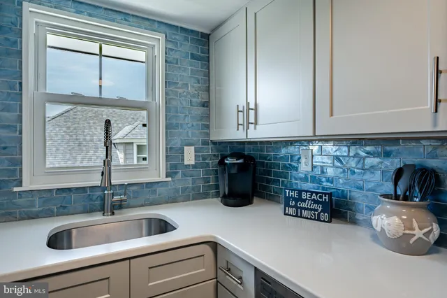 a kitchen with a sink and cabinets
