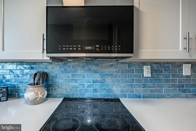 a kitchen with a stove and a microwave