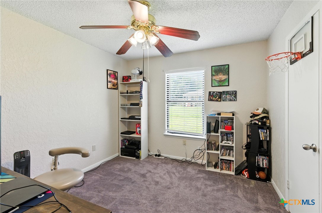 127 Jordan Loop Nolanville, TX 76559 - Photo 11 of 18 a view of a bedroom with furniture and a window