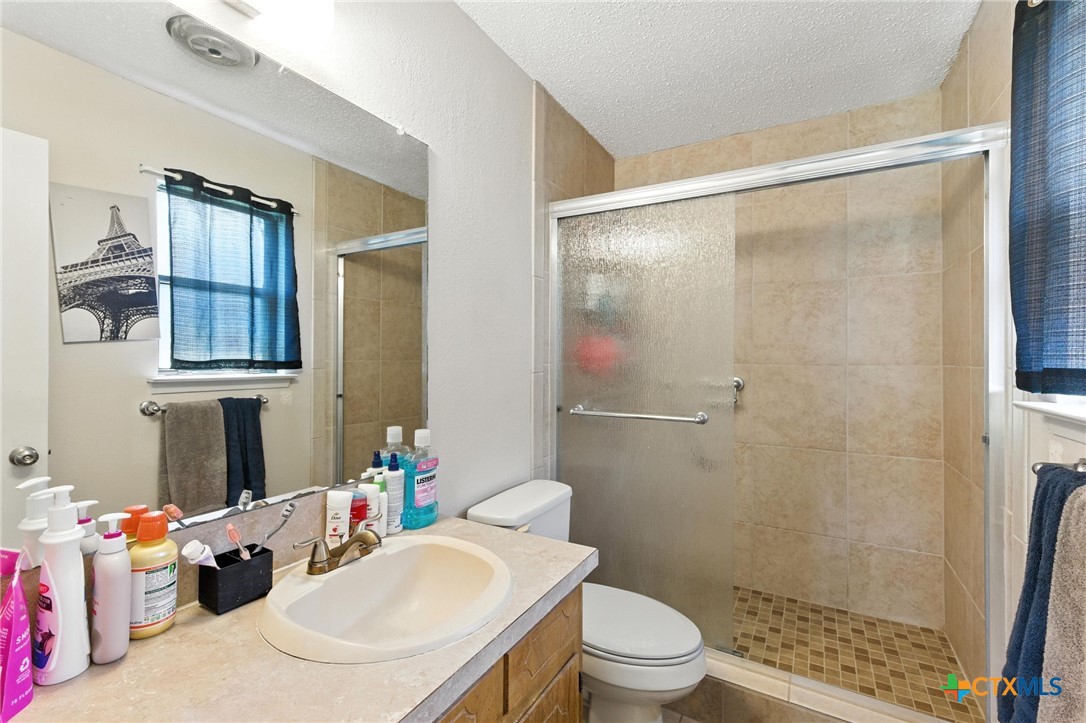 127 Jordan Loop Nolanville, TX 76559 - Photo 12 of 18 a bathroom with a sink toilet and shower