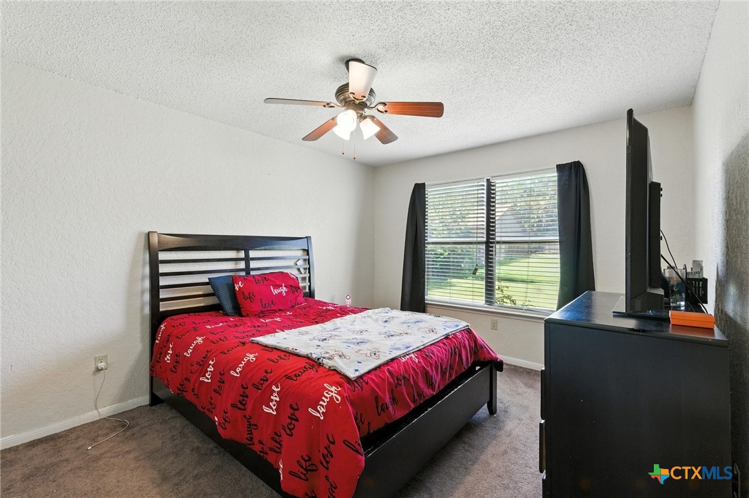 127 Jordan Loop Nolanville, TX 76559 - Photo 13 of 18 a bedroom with a bed and window