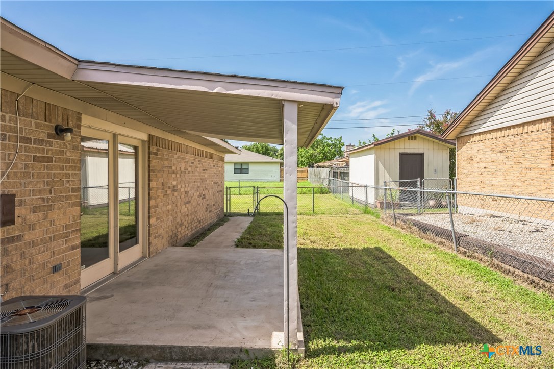 127 Jordan Loop Nolanville, TX 76559 - Photo 16 of 18 a view of a house with backyard and porch