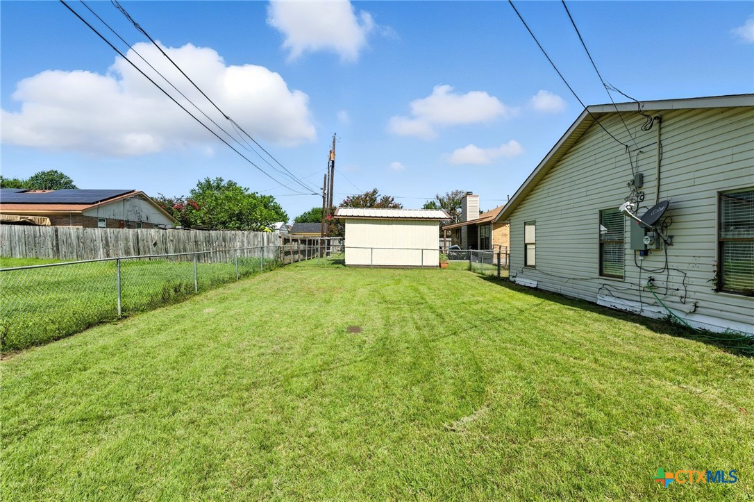 127 Jordan Loop Nolanville, TX 76559 - Photo 17 of 18 a view of a backyard with a garden
