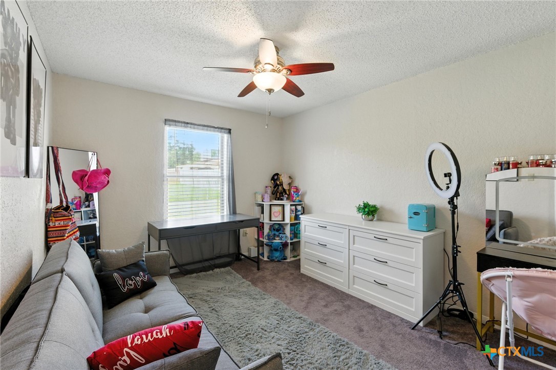 127 Jordan Loop Nolanville, TX 76559 - Photo 10 of 18 a bedroom with furniture and a window