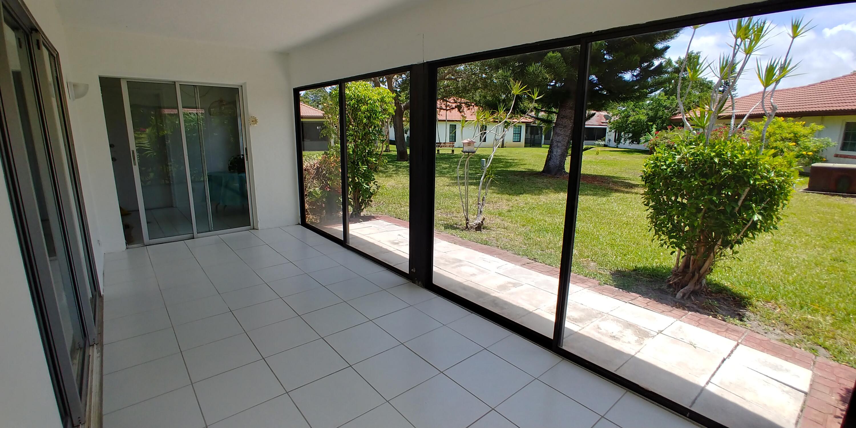 354 Northwest 42nd Street Boca Raton, FL 33431 - Photo 11 of 36 Porch - garden view