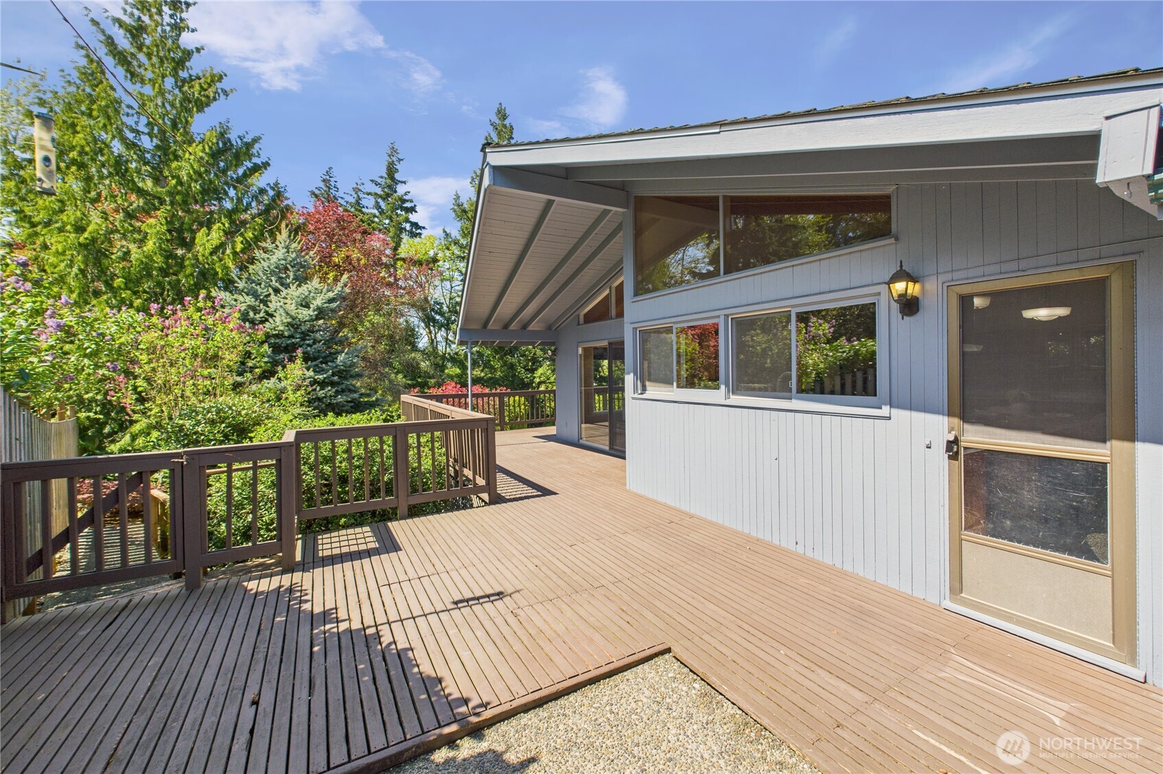 1323 121st Avenue Southeast Bellevue, WA 98005 - Photo 17 of 28 a balcony with wooden floor and furniture