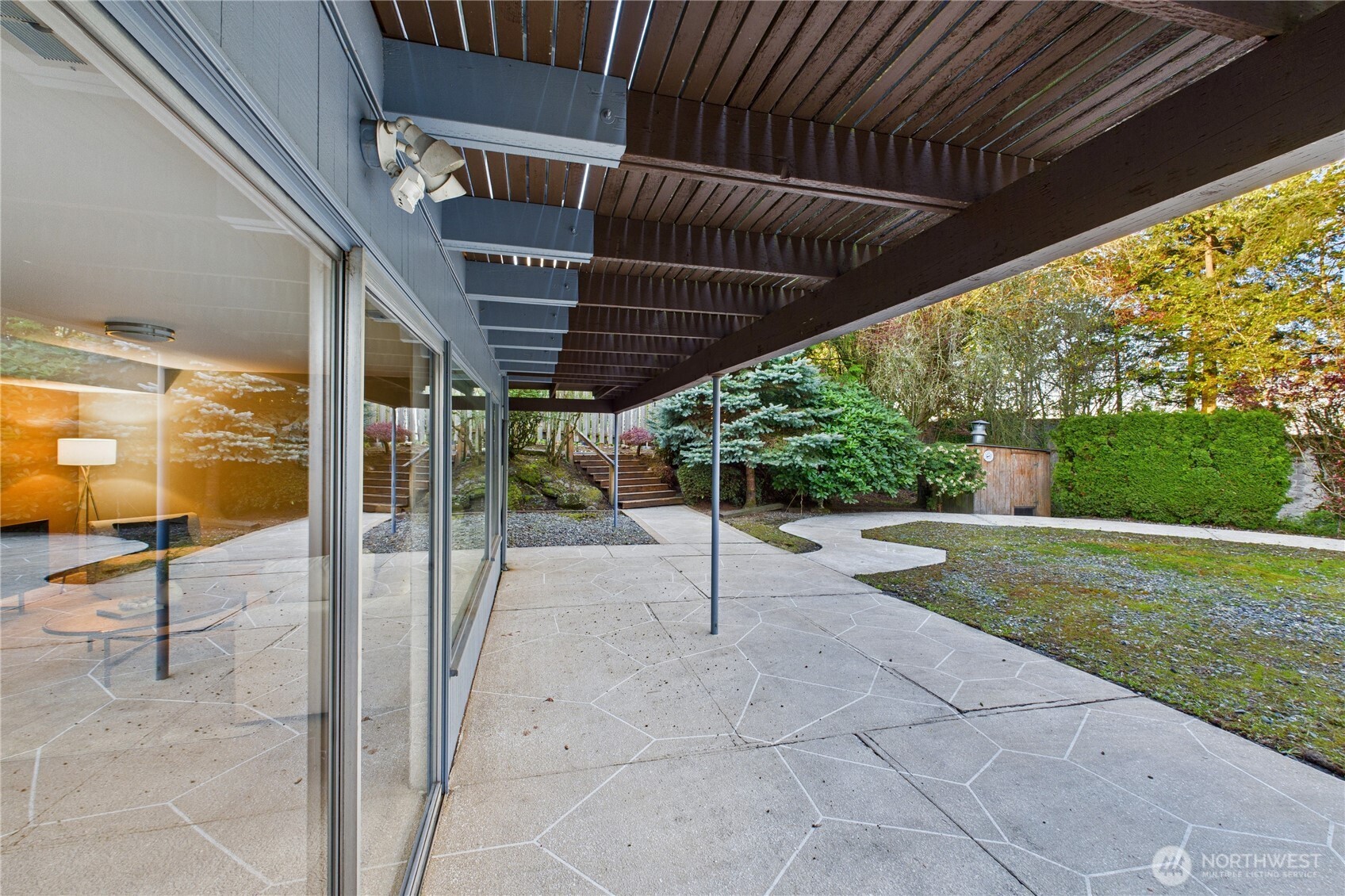 1323 121st Avenue Southeast Bellevue, WA 98005 - Photo 18 of 28 a view of a porch with furniture and a yard
