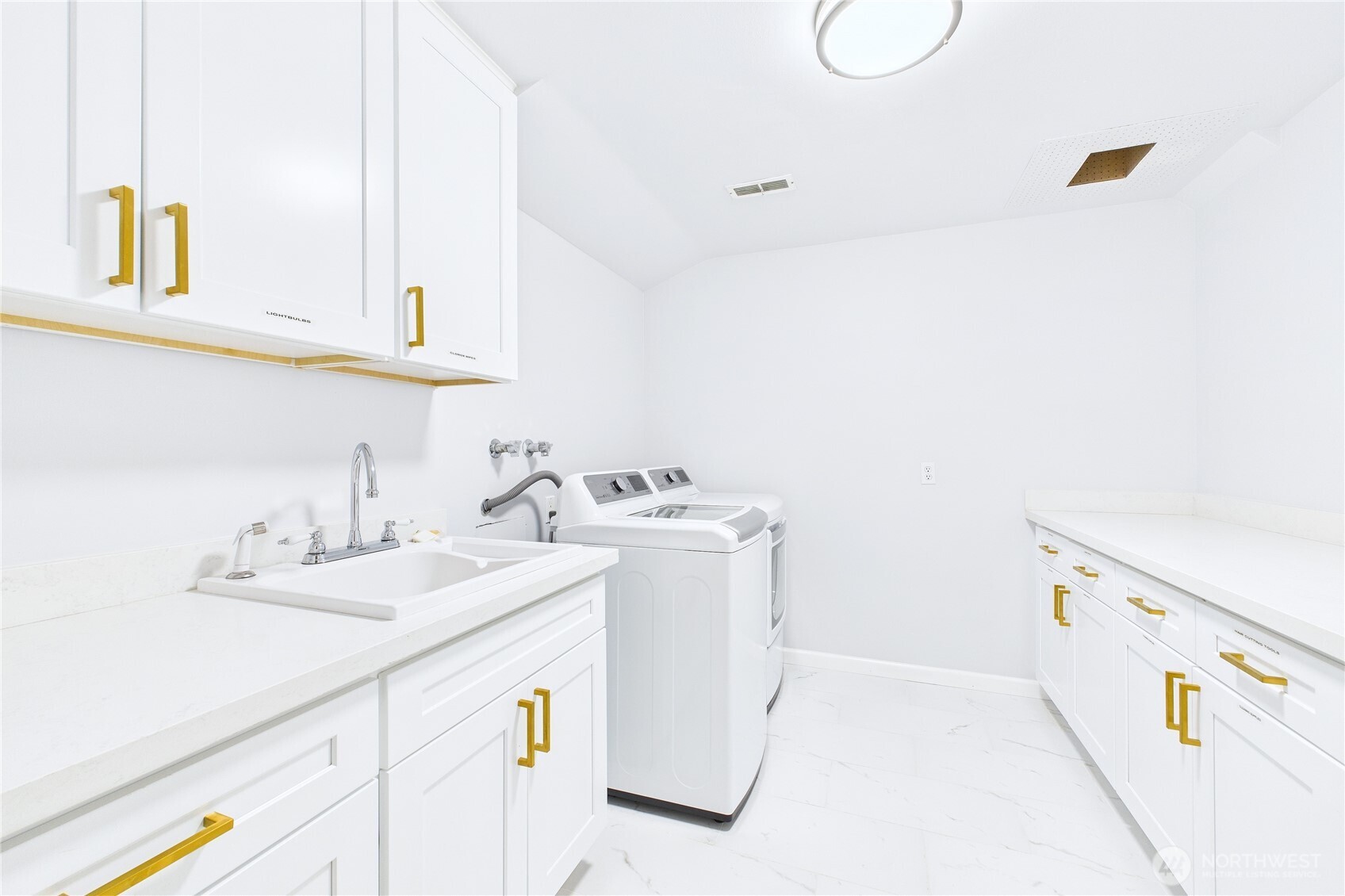 1323 121st Avenue Southeast Bellevue, WA 98005 - Photo 21 of 28 a utility room with dryer and washer