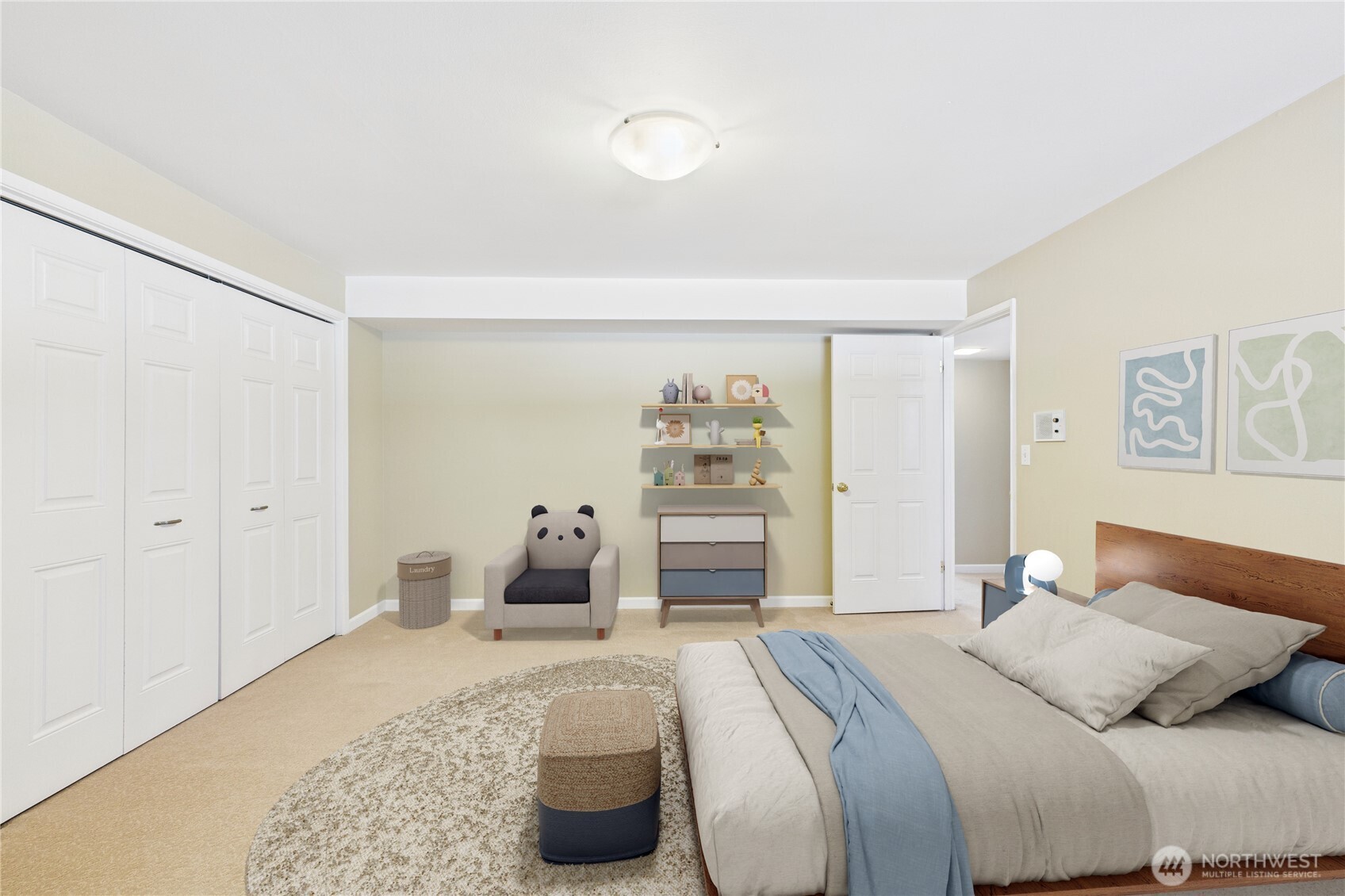 1323 121st Avenue Southeast Bellevue, WA 98005 - Photo 23 of 28 a bedroom with a large bed and dresser