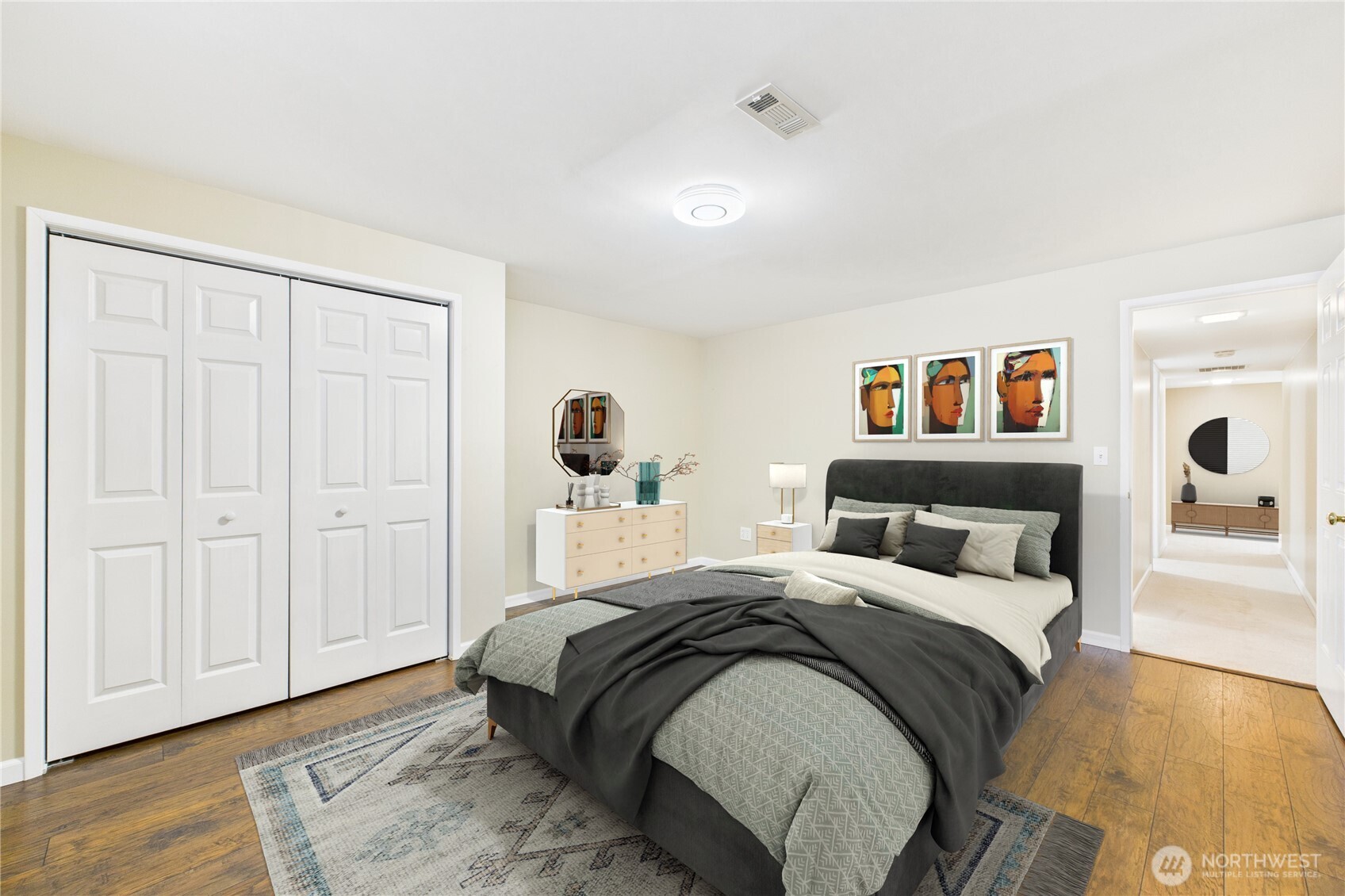 1323 121st Avenue Southeast Bellevue, WA 98005 - Photo 24 of 28 a view of a bedroom with a bed and wooden floor