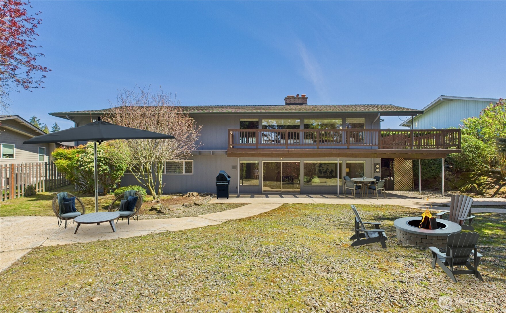 1323 121st Avenue Southeast Bellevue, WA 98005 - Photo 25 of 28 a view of a chairs and table in the patio and a table and chairs in the patio