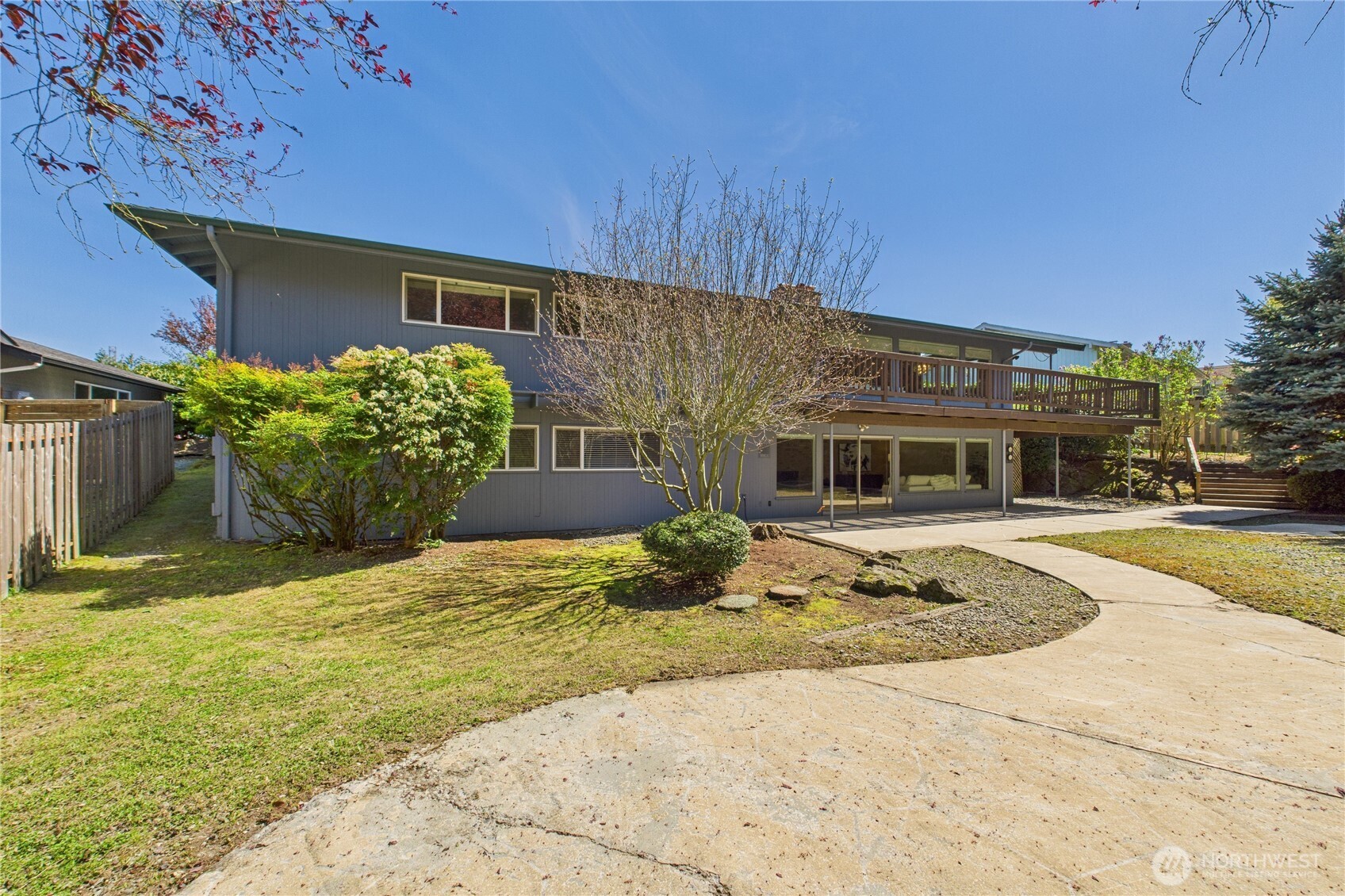 1323 121st Avenue Southeast Bellevue, WA 98005 - Photo 26 of 28 a front view of a house with a yard