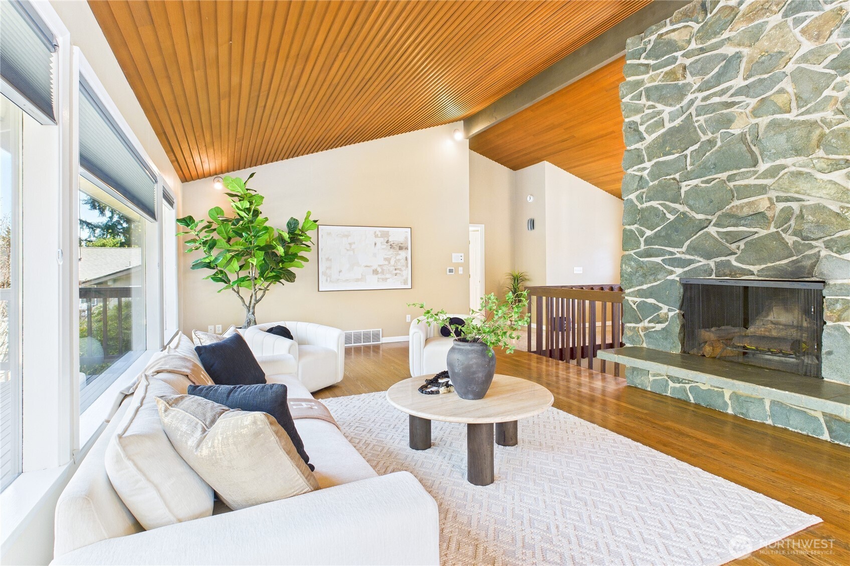 1323 121st Avenue Southeast Bellevue, WA 98005 - Photo 4 of 28 a living room with furniture and a fireplace