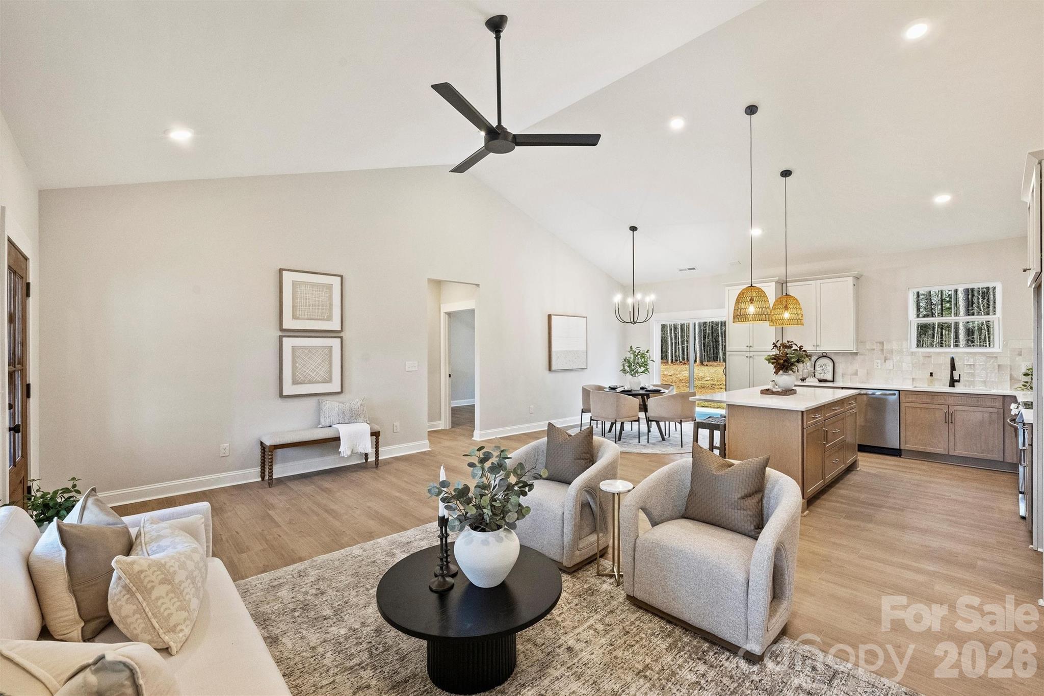 2307 Lee Lawing Road Lincolnton, NC 28092 - Photo 15 of 42 a living room with furniture kitchen view and a chandelier