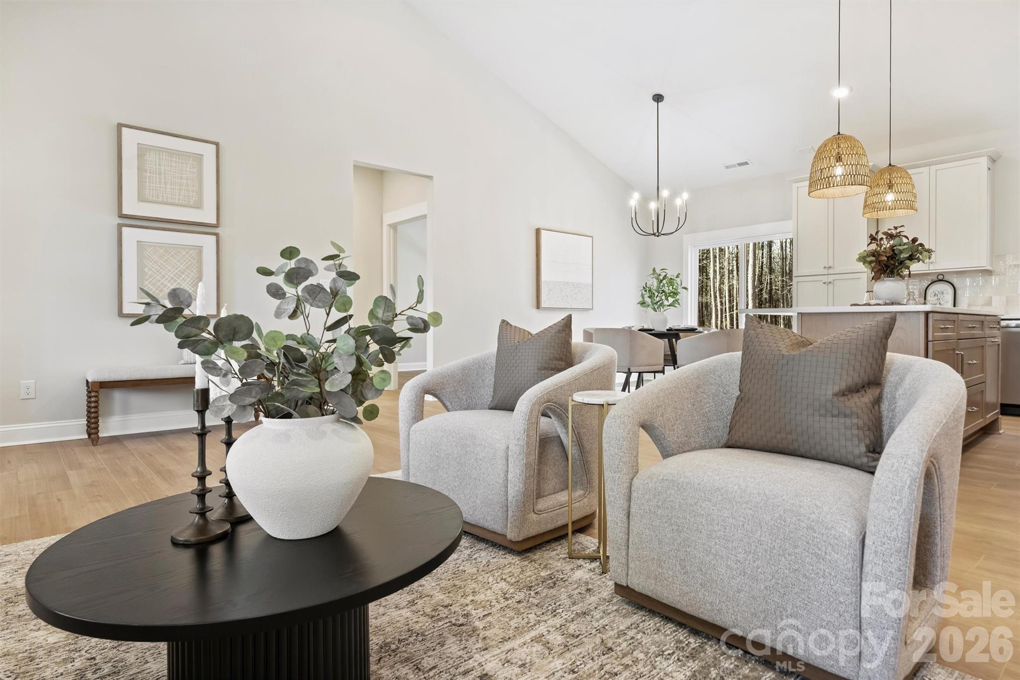 2307 Lee Lawing Road Lincolnton, NC 28092 - Photo 16 of 42 a living room with furniture a chandelier and a table