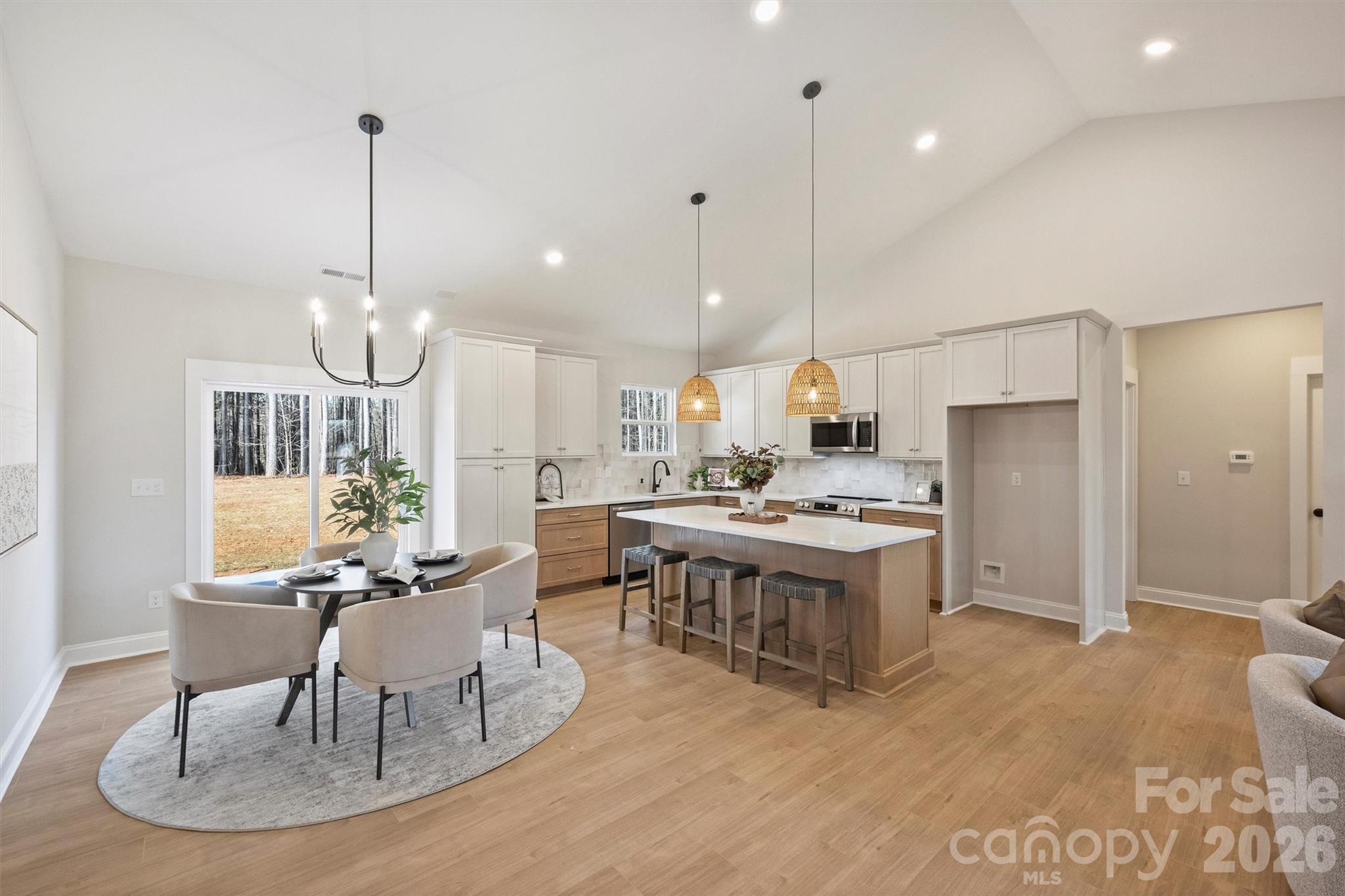 2307 Lee Lawing Road Lincolnton, NC 28092 - Photo 17 of 42 a large kitchen with a table and chairs
