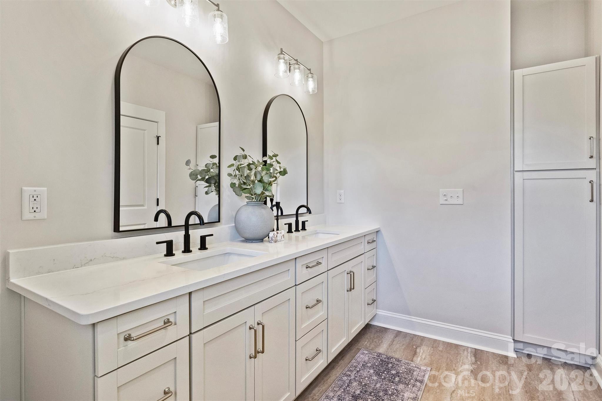 2307 Lee Lawing Road Lincolnton, NC 28092 - Photo 27 of 40 a bathroom with a double vanity sink and a mirror