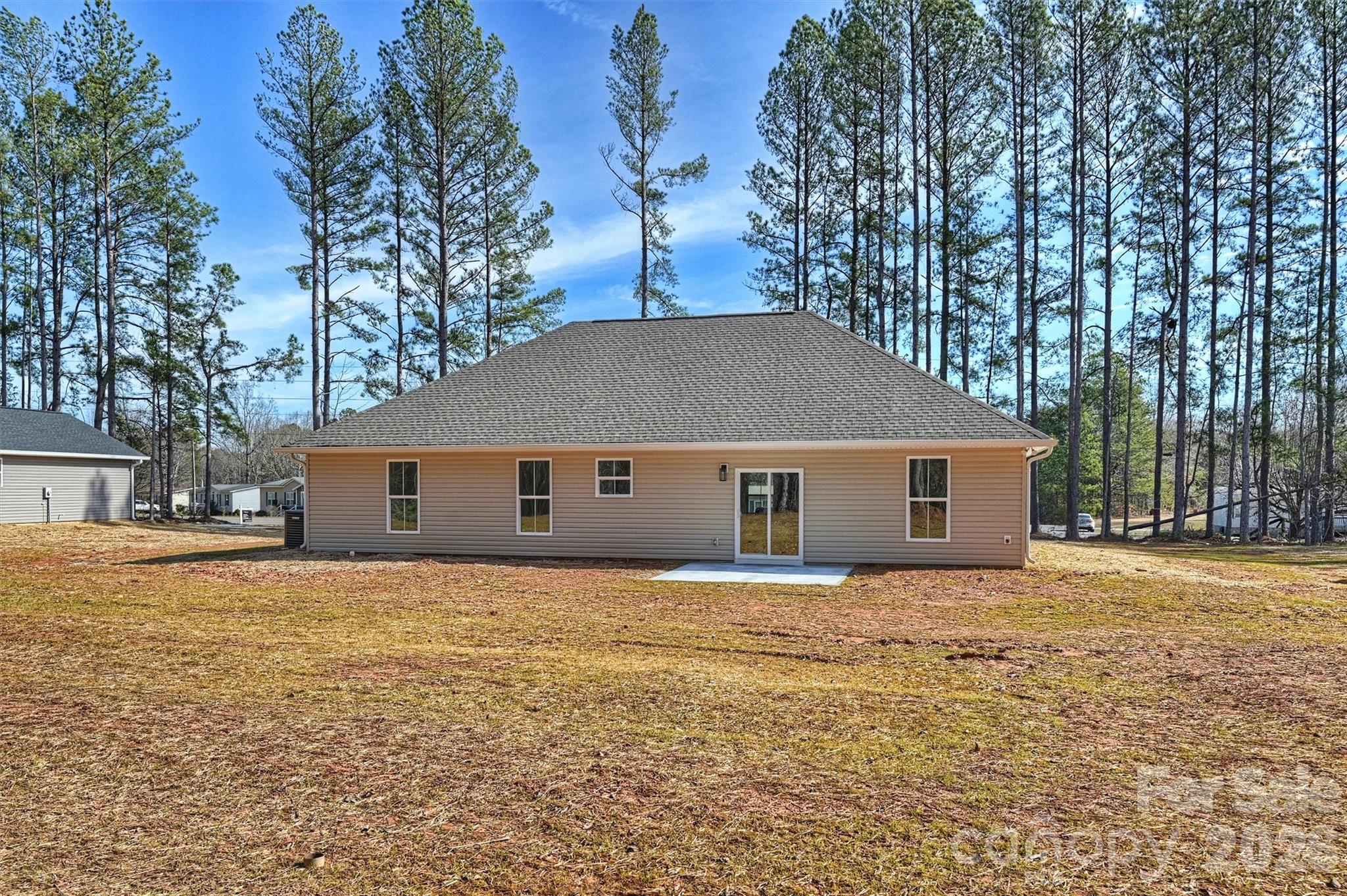 2307 Lee Lawing Road Lincolnton, NC 28092 - Photo 39 of 40 a backyard of a house with large trees